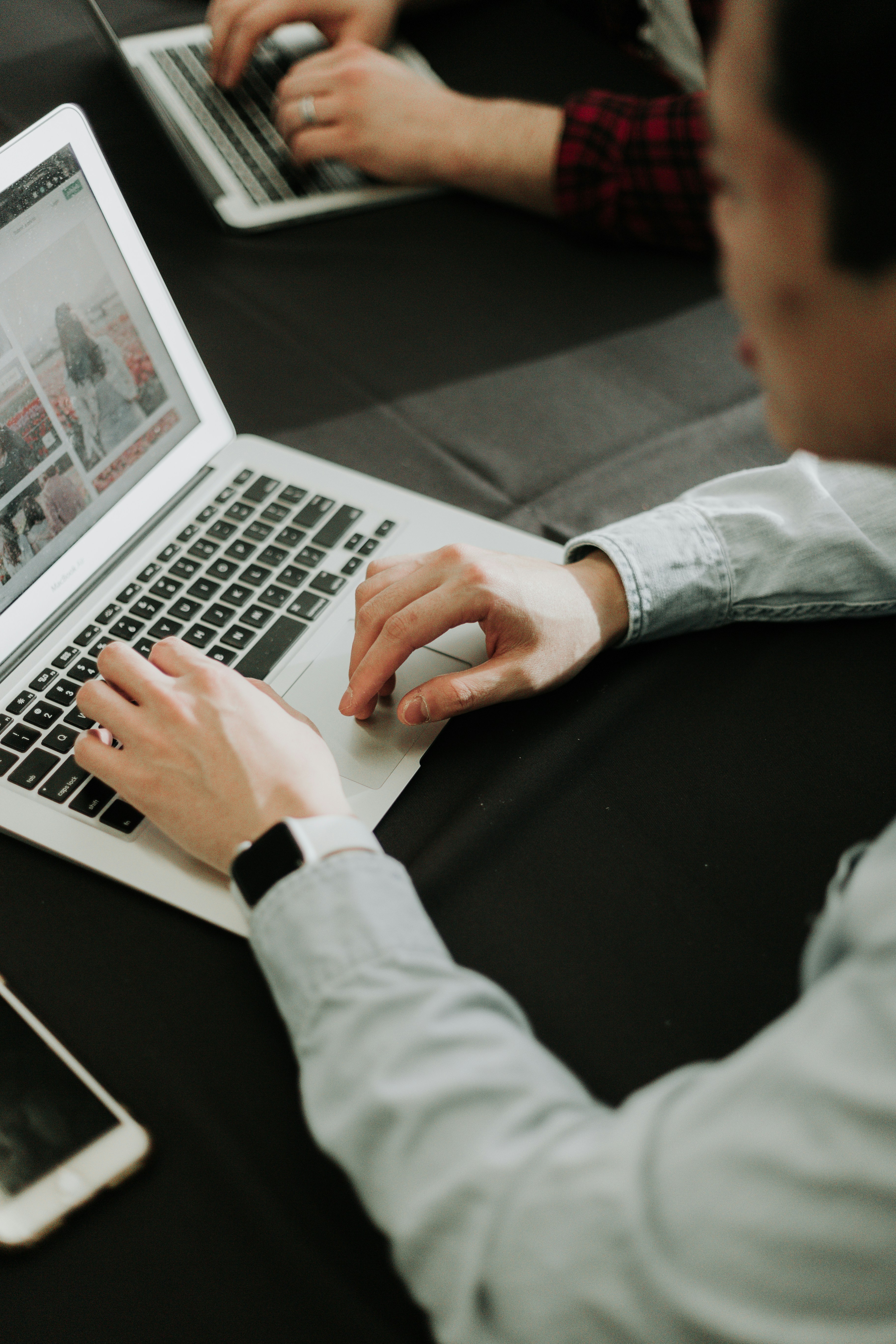 person typing on a laptop
